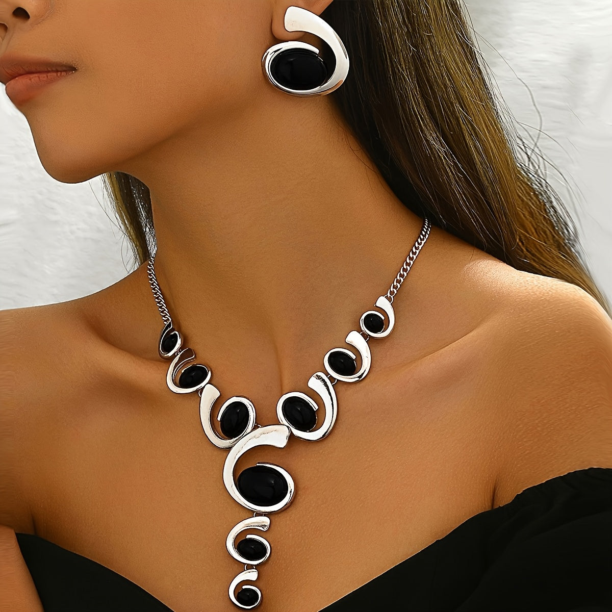 Two-piece Women's jewelry set: one spiral snail-shaped black rhinestone gradient Y-necklace and a pair of spiral snail-shaped black rhinestone earrings, classic versatile design for daily wear or party occasions