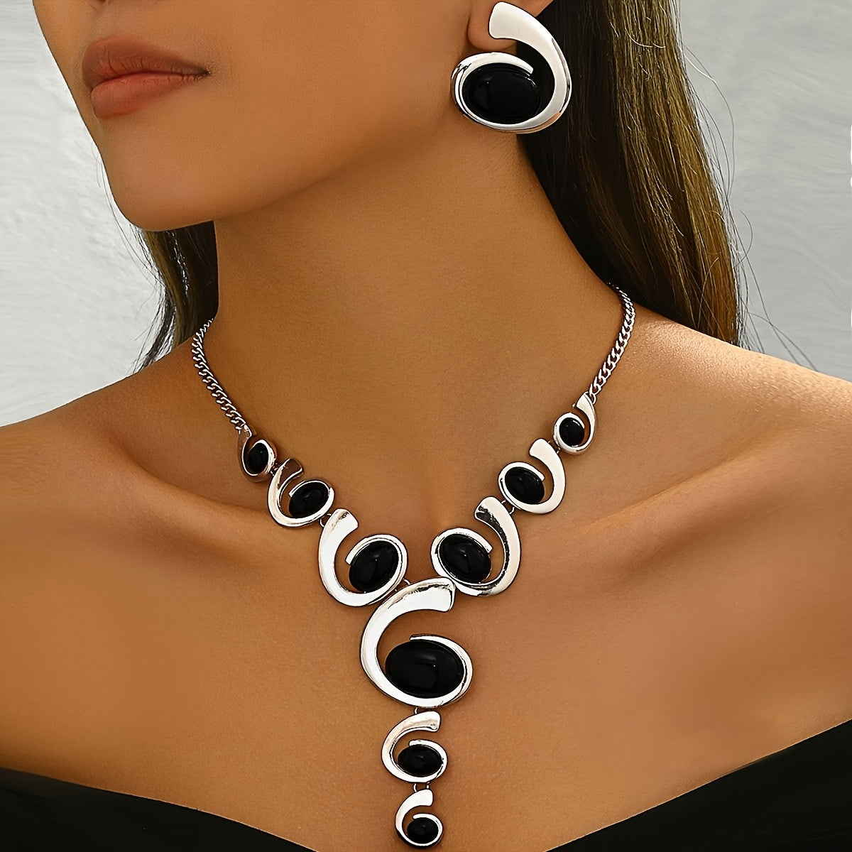 Two-piece Women's jewelry set: one spiral snail-shaped black rhinestone gradient Y-necklace and a pair of spiral snail-shaped black rhinestone earrings, classic versatile design for daily wear or party occasions